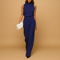 Sleeveless halter jumpsuit for women with high waist, wide legs, and decorative bow detail, perfect for summer dinners and evening occasions.